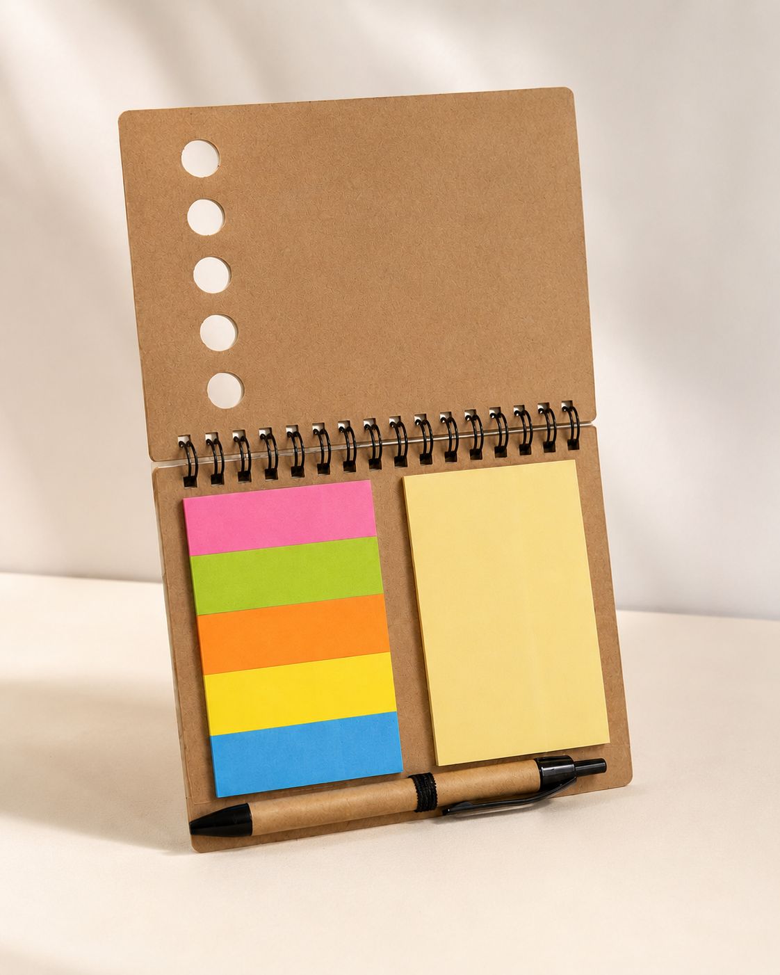 Compact notebook with sticky notes and pen