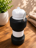 Black Foldable Water Bottle folded flat, corporate gift by Veloura Gifting